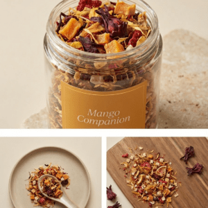 CozySlip Mango Companion fruit tea blend in a glass jar, with close-ups of dried mango chunks, hibiscus flowers, and herbal pieces on a plate and wooden board — showcasing natural ingredients and cozy lifestyle appeal.