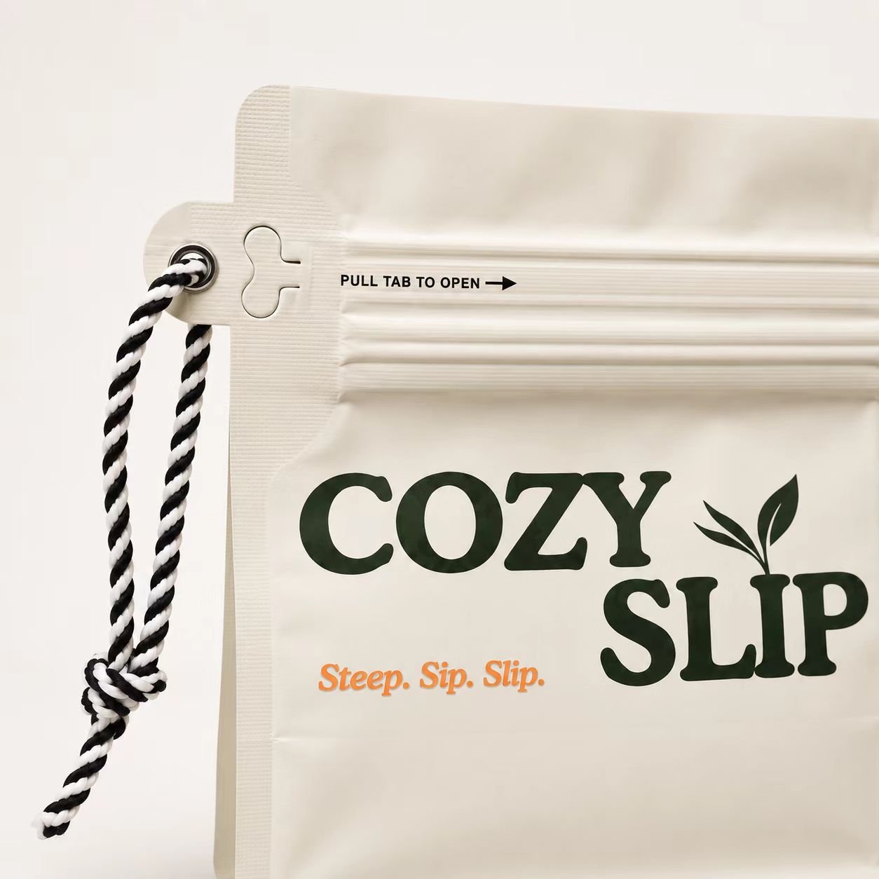 Close-up of Cozyslip tea package logo on a white pouch