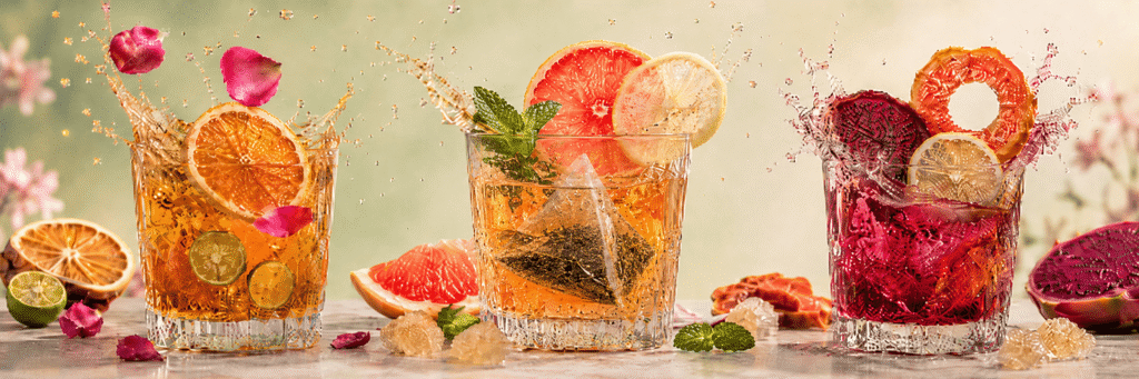 Three colorful Cozyslip fruit tea rituals with citrus, mint, rose, papaya and dragon fruit